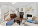 Inviting living room with hardwood floors, fireplace, and staircase at 4462 Haddington Dr, Fort Mill, SC 29707
