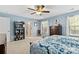 View of the main bedroom featuring an ensuite bath, walk-in closet, and a stylish display shelf at 4462 Haddington Dr, Fort Mill, SC 29707