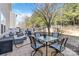 Cozy patio with cushioned seating, dining table, and manicured backyard at 4462 Haddington Dr, Fort Mill, SC 29707