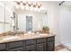 Bathroom featuring a double vanity with decorative granite countertops at 5011 Sharon Rd # B, Charlotte, NC 28210