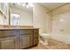 Bathroom features a tiled floor, grey vanity with stone countertops and a shower and tub at 5011 Sharon Rd # B, Charlotte, NC 28210