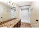 Bathroom featuring a double vanity, granite counters, and walk-in shower at 5011 Sharon Rd # B, Charlotte, NC 28210