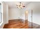 Spacious bedroom with hardwood floors, ceiling fan, and ample natural light at 5011 Sharon Rd # B, Charlotte, NC 28210