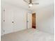 Bright bedroom features neutral carpet, ceiling fan, and white trim throughout at 5011 Sharon Rd # B, Charlotte, NC 28210