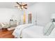 Bright bedroom with a ceiling fan, closet, and doorway to another area at 5011 Sharon Rd # B, Charlotte, NC 28210