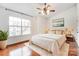 Bright bedroom featuring a large window, hardwood floors, and stylish decor at 5011 Sharon Rd # B, Charlotte, NC 28210