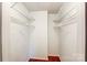 Walk-in closet with ample shelving and hardwood floors at 5011 Sharon Rd # B, Charlotte, NC 28210