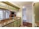 Updated kitchen with stainless steel appliances and granite countertops opens to the living room at 5011 Sharon Rd # B, Charlotte, NC 28210