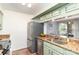 Bright kitchen featuring stainless steel appliances, granite countertops, and modern cabinetry at 5011 Sharon Rd # B, Charlotte, NC 28210
