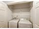 Convenient laundry closet features side-by-side washer and dryer with ample shelving at 5011 Sharon Rd # B, Charlotte, NC 28210