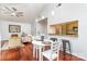 Open concept living and dining area with hardwood floors and ample seating at 5011 Sharon Rd # B, Charlotte, NC 28210