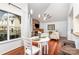 Cozy living room featuring hardwood floors, a fireplace, and ample natural light at 5011 Sharon Rd # B, Charlotte, NC 28210