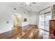 Bright and airy living room with wood floors, high ceilings, and access to the kitchen at 5011 Sharon Rd # B, Charlotte, NC 28210