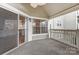 Charming covered patio with sliding glass doors overlooking the neighborhood at 5011 Sharon Rd # B, Charlotte, NC 28210
