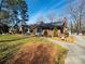 Lovely brick home with landscaped front yard and stone walkway at 505 Tuttlewood Dr, Kannapolis, NC 28083