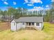 Rear exterior view of the home showcasing the backyard, deck, and well-kept grounds at 5147 Star Magnolia Ct, Clover, SC 29710