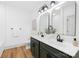 Bright bathroom features a double vanity, framed mirrors, and modern fixtures at 5147 Star Magnolia Ct, Clover, SC 29710
