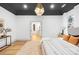 Modern bedroom with neutral tones, featuring a textured rug and ample natural light at 5147 Star Magnolia Ct, Clover, SC 29710