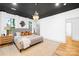 Modern bedroom with dark ceiling, white walls, large windows, and stylish pendant lighting at 5147 Star Magnolia Ct, Clover, SC 29710