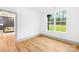Spacious bedroom with a large window and stylish gray trim, showcasing natural light at 5147 Star Magnolia Ct, Clover, SC 29710