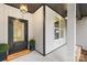 Inviting front porch with a dark front door and a 'Welcome' mat at 5147 Star Magnolia Ct, Clover, SC 29710