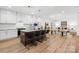 Modern kitchen featuring stainless steel appliances, a marble island, and an open layout at 5147 Star Magnolia Ct, Clover, SC 29710