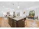 Open kitchen features a marble island with barstool seating and an adjacent dining area at 5147 Star Magnolia Ct, Clover, SC 29710