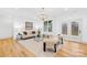 Bright and airy living room featuring neutral tones and an outdoor view, with overhead light fixture at 5147 Star Magnolia Ct, Clover, SC 29710