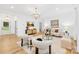 Bright living room with modern furnishings and large windows, with an overhead light fixture at 5147 Star Magnolia Ct, Clover, SC 29710