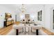 Bright living room with modern furnishings and large windows, with an overhead light fixture at 5147 Star Magnolia Ct, Clover, SC 29710