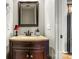 Half bath showing vanity with granite countertop and wood cabinets at 5472 Ives Nw St, Concord, NC 28027