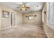 Large bedroom with neutral carpet, ceiling fan and a view of another room at 5472 Ives Nw St, Concord, NC 28027