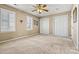 Spacious bedroom featuring neutral carpet, ceiling fan, and ample natural light at 5472 Ives Nw St, Concord, NC 28027