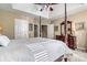 Bedroom with a bed and dresser, with multiple doors and stairway access at 5472 Ives Nw St, Concord, NC 28027