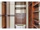 Custom wood closet with drawers, shelving and ample space for storage and organization at 5472 Ives Nw St, Concord, NC 28027