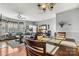 Open floor plan dining room and living room with hardwood floors and plenty of natural light at 5472 Ives Nw St, Concord, NC 28027