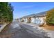 Row of townhomes with attached garages and well-kept exteriors at 5472 Ives Nw St, Concord, NC 28027