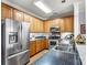 Bright kitchen with stainless steel appliances, double sink, and ample cabinet space at 5472 Ives Nw St, Concord, NC 28027