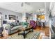 Spacious living room featuring hardwood floors, open concept design, and comfortable seating at 5472 Ives Nw St, Concord, NC 28027