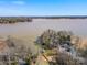Breathtaking aerial view of a waterfront estate, complete with a private dock and lush surroundings at 5981 Johnson Rd, Lake Wylie, SC 29710
