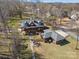 Aerial view of a charming log cabin style home with lush landscaping and a picturesque setting, perfect for a serene retreat at 5981 Johnson Rd, Lake Wylie, SC 29710