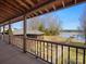 Inviting back porch with scenic views of the lake and a well-manicured yard, creating a perfect outdoor living space at 5981 Johnson Rd, Lake Wylie, SC 29710