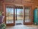 Bright interior showcasing sliding glass doors with lake view access to a balcony, complemented by tiled flooring at 5981 Johnson Rd, Lake Wylie, SC 29710