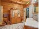 Bathroom featuring wood paneling, a sink and a closet at 5981 Johnson Rd, Lake Wylie, SC 29710