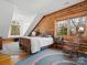 Charming bedroom features wood paneling, hardwood floors and a bright window at 5981 Johnson Rd, Lake Wylie, SC 29710