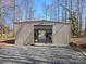Large metal outbuilding with roll-up door, perfect for storing boats and recreational equipment on a wooded lot at 5981 Johnson Rd, Lake Wylie, SC 29710