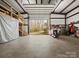 Large steel warehouse or garage with a view to the outdoors at 5981 Johnson Rd, Lake Wylie, SC 29710