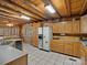 Spacious kitchen featuring wooden cabinetry and a large refrigerator at 5981 Johnson Rd, Lake Wylie, SC 29710