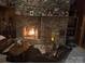 Inviting living room with a stone fireplace, creating a cozy and rustic atmosphere at 5981 Johnson Rd, Lake Wylie, SC 29710