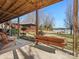 Inviting covered patio with wood furnishings, offering lake views and access to the property's exterior at 5981 Johnson Rd, Lake Wylie, SC 29710